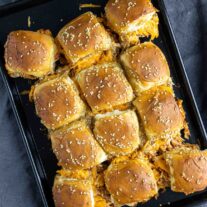 baked BBQ chicke sliders on a baking sheet