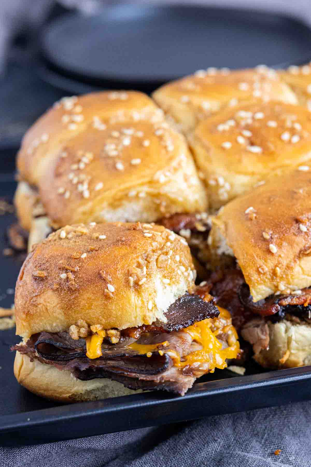 Roast Beef Sliders with Brown Sugar Bacon on a sheet pan