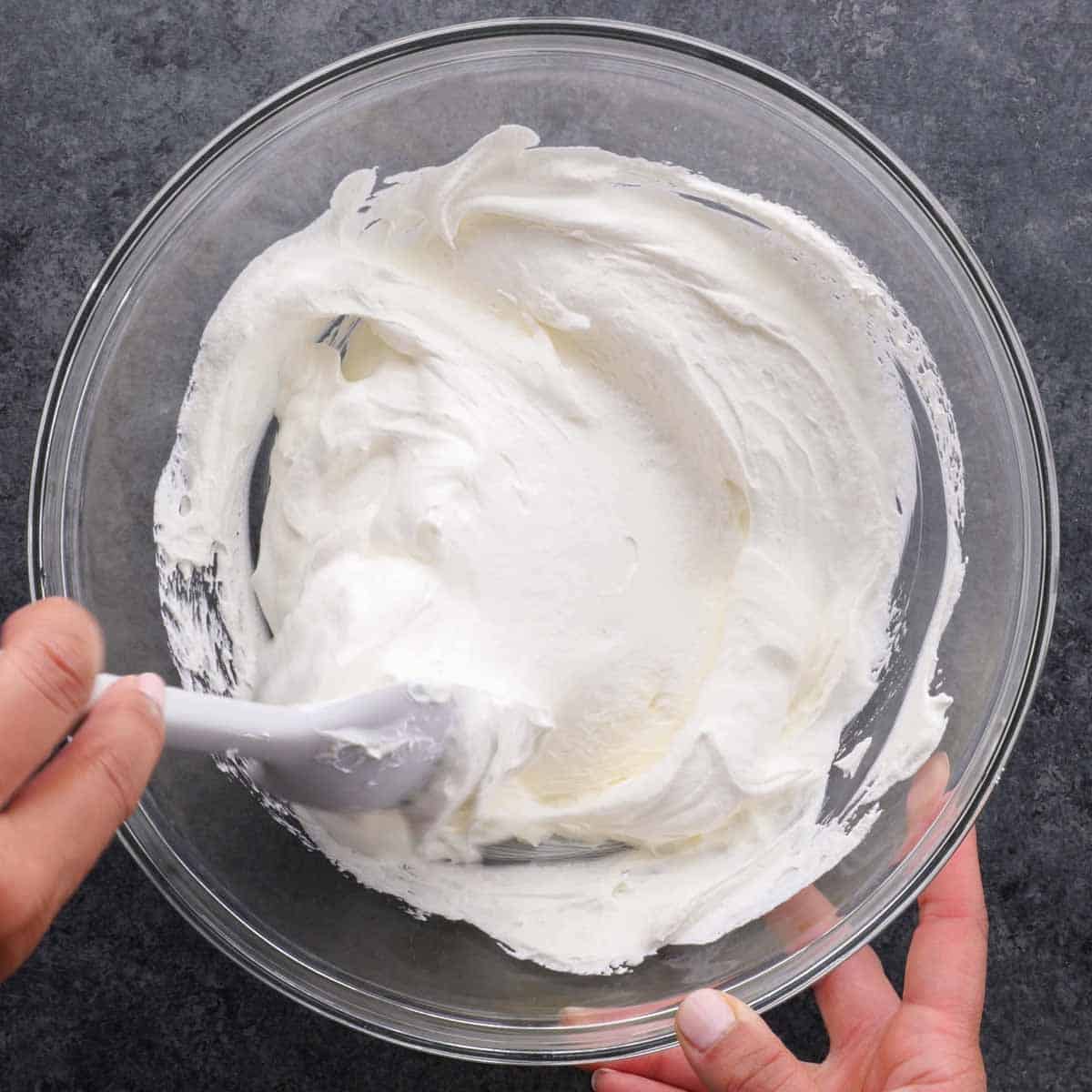 step pic of stirring together cool whip and sour cream