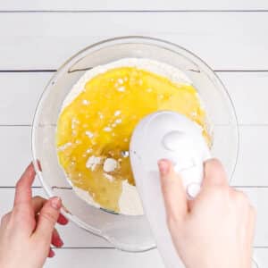 adding eggs to the cake batter