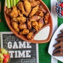 A football game time party with food and drinks on a football field.