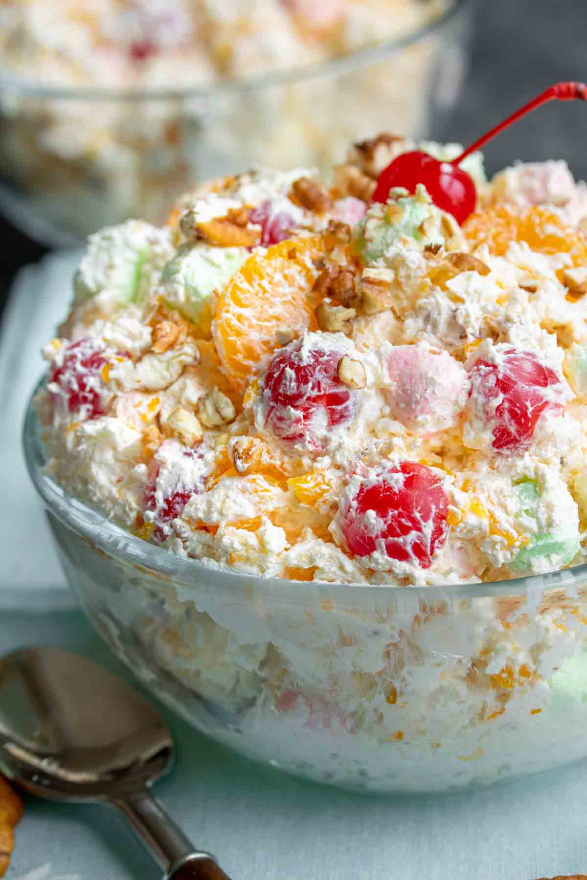 marshmallow fruit salad in a clear glass bowl
