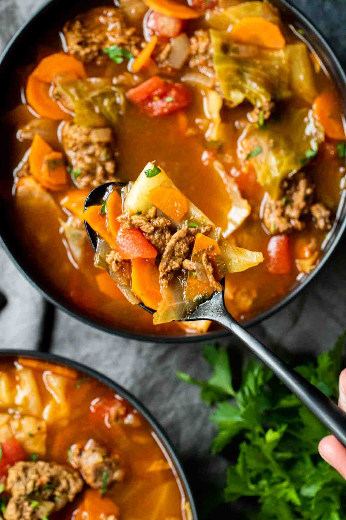 two bowls of INSTANT POT CABBAGE ROLL SOUP