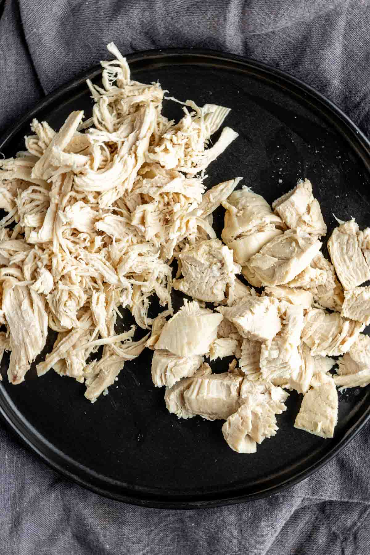 shredded and cubed chicken on a plate