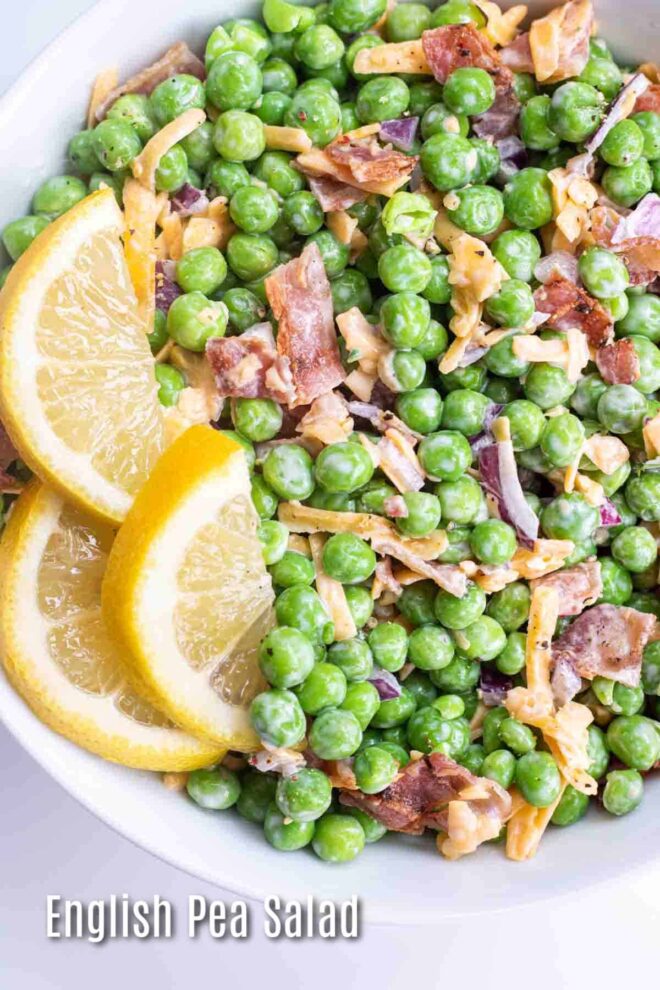 pinterest image of english pea salad in a white bowl with lemon slices