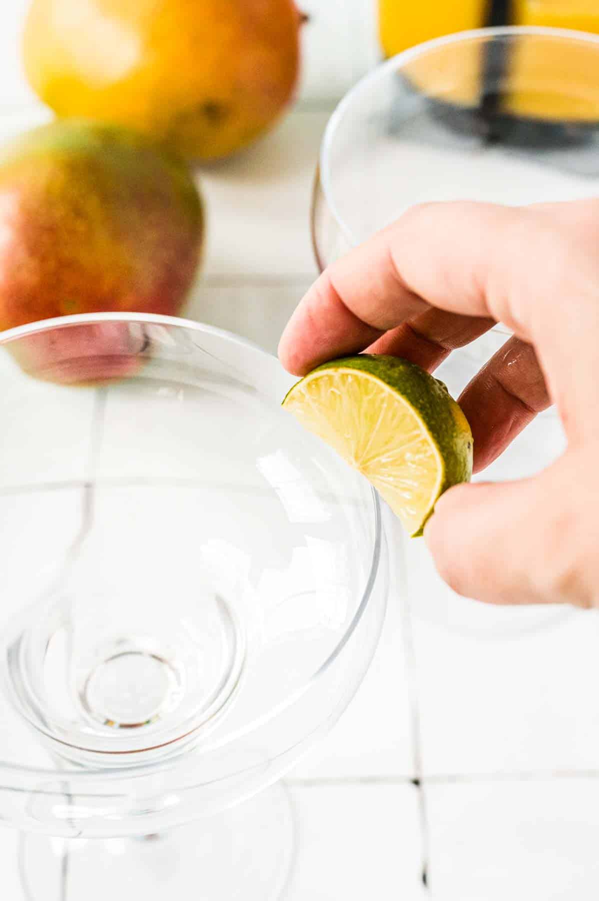 how to salt a rim using a lime wedge for Frozen Mango Margarita
