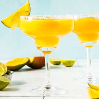 Frozen Mango Margarita in glasses with salted rims