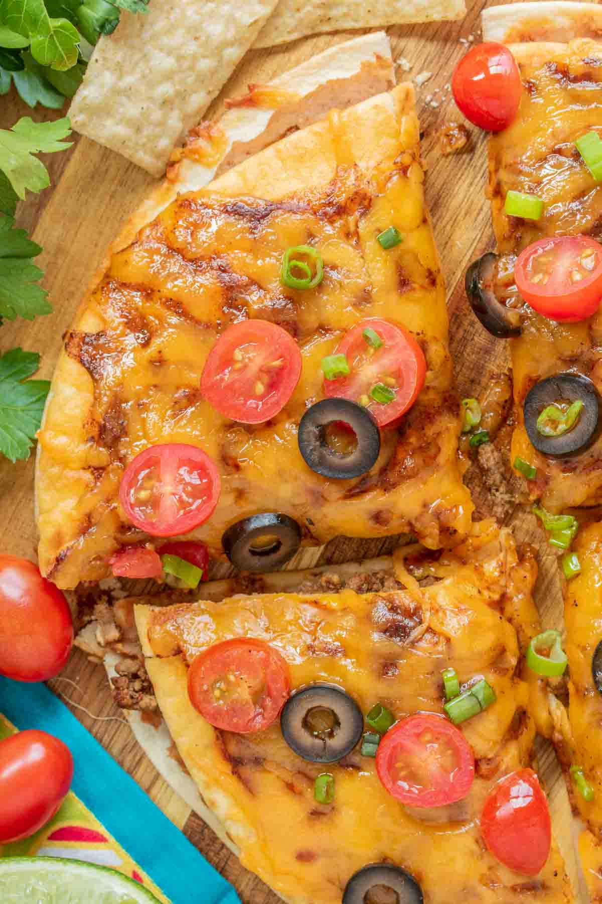 sliced Taco Bell Mexican Pizza with tomatoes