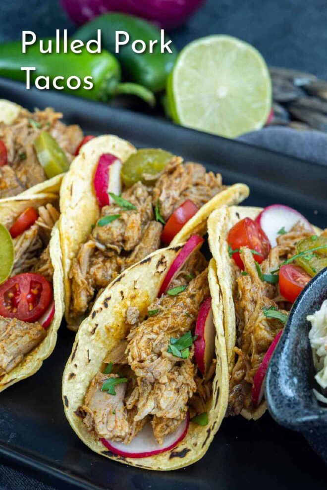 pinterest image of Pulled Pork Tacos on a plate on corn tortillas