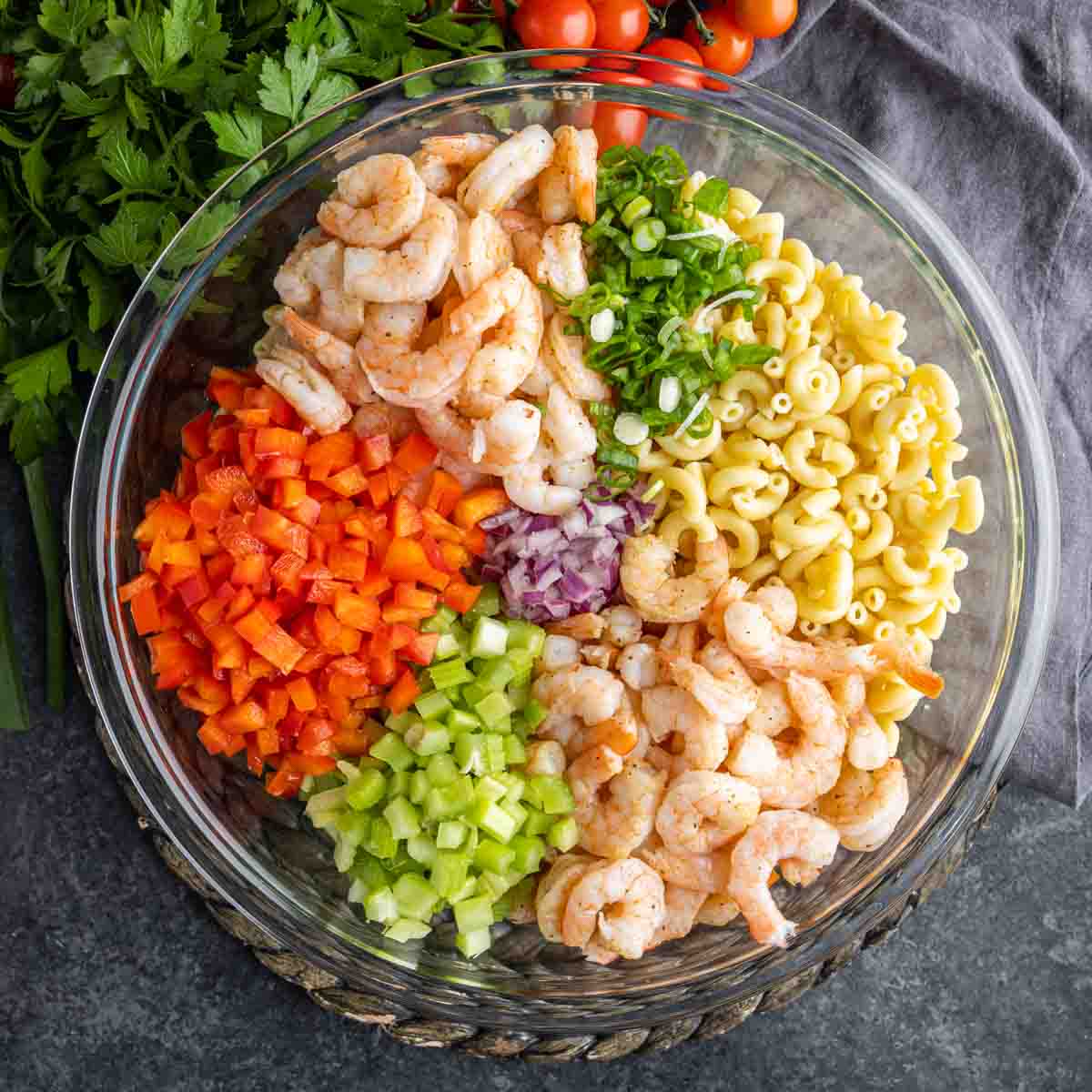 Shrimp Pasta Salad ingrediets in a glass bowl
