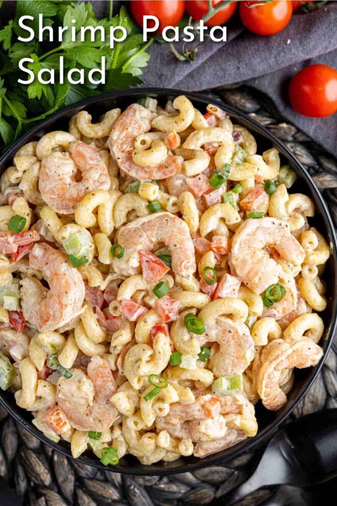 pinterest image of Shrimp Pasta Salad in a bowl with parsley and cherry tomatoes
