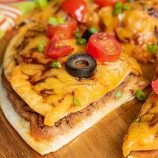 slice of Taco Bell Mexican Pizza on wooden board
