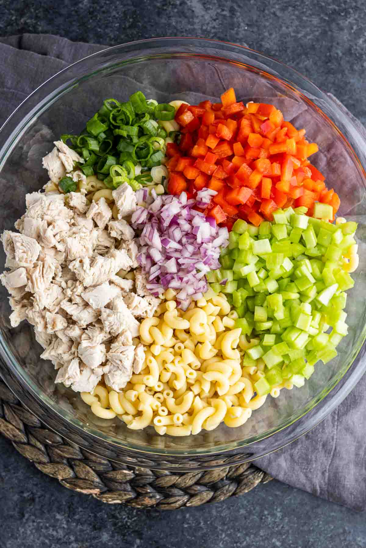 Chicken Macaroni Salad ingredients in a glass bowl without dressing