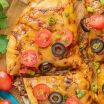 sliced Taco Bell Mexican Pizza with tomatoes