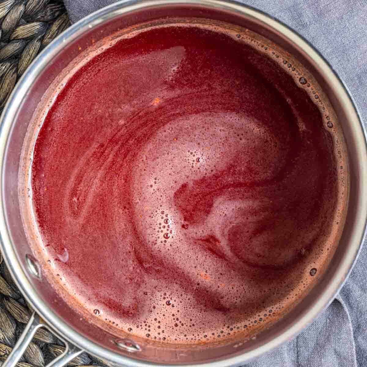 strained Strawberry Coulis in sauce pan