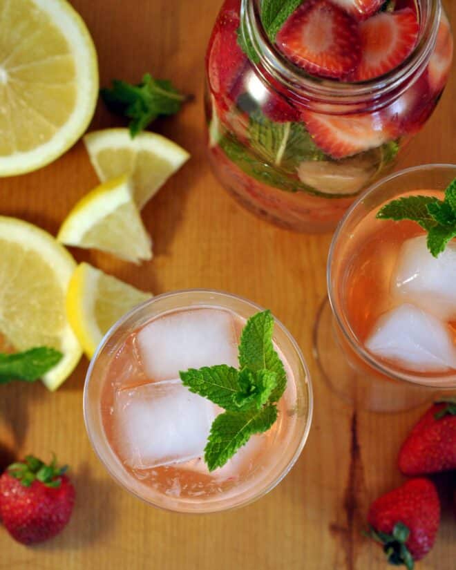 top down picture of glasses filled with strawberry grapefruit water and mint