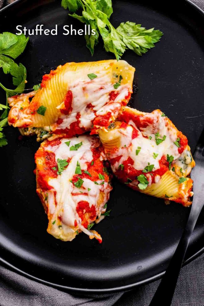 pinterest image of Stuffed Shellson a black plate with parsley