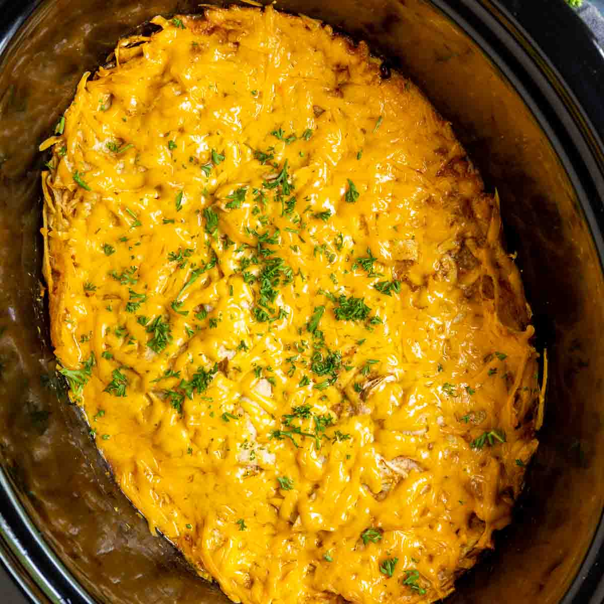 slow cooker with cheesy Crock Pot Chicken Enchiladas