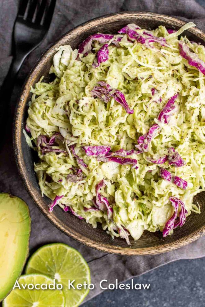 pinterest image of Avocado Keto Coleslaw in wooden bowl with lime slices