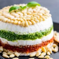 Pesto Cream Cheese Spread layers with pine nuts