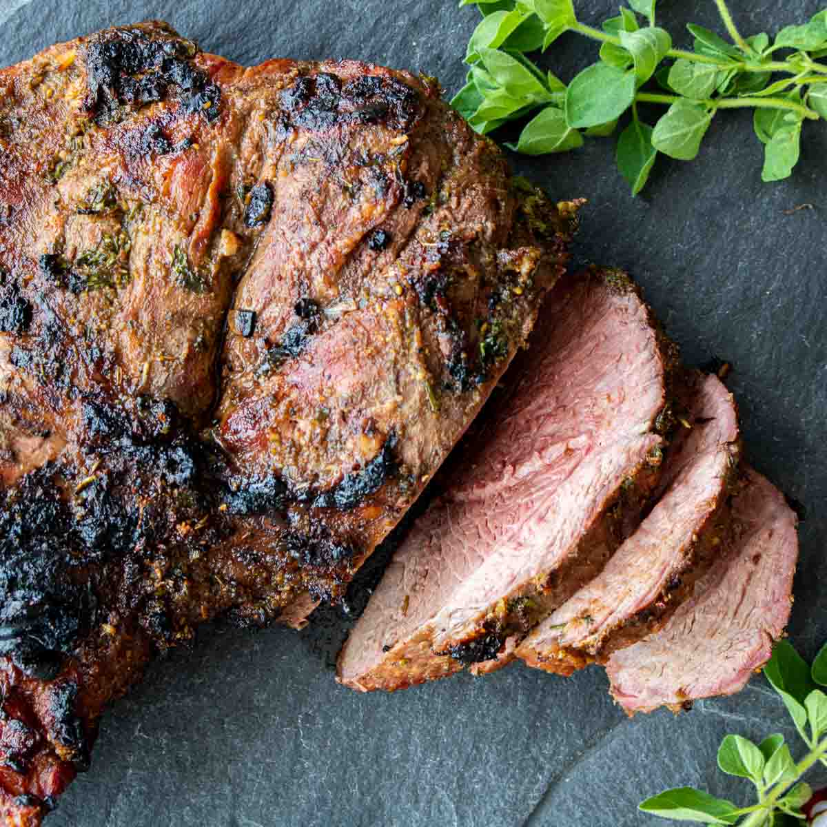 Top down picture of sliced , grilled leg of lamb