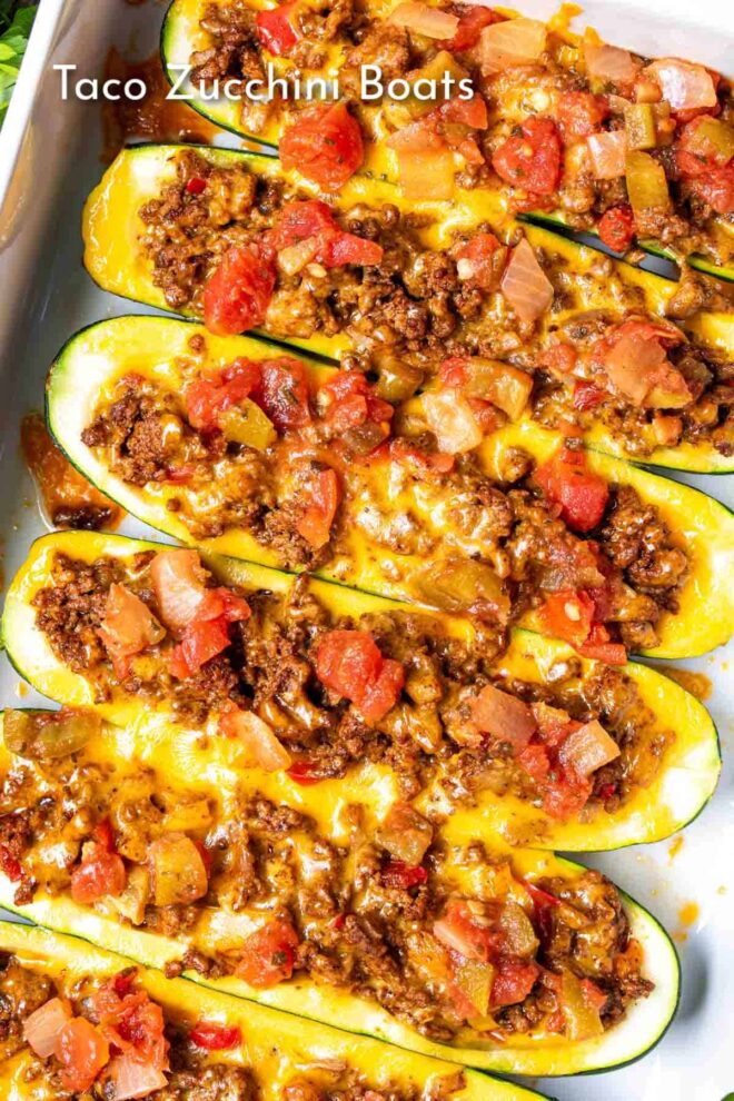 pinterest image of Taco Zucchini Boats in white dish