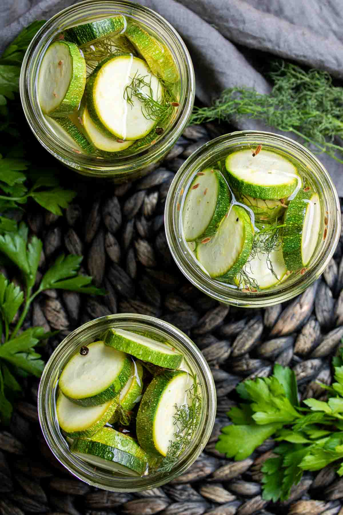 three mason jars filled with Quick Pickled Zucchini