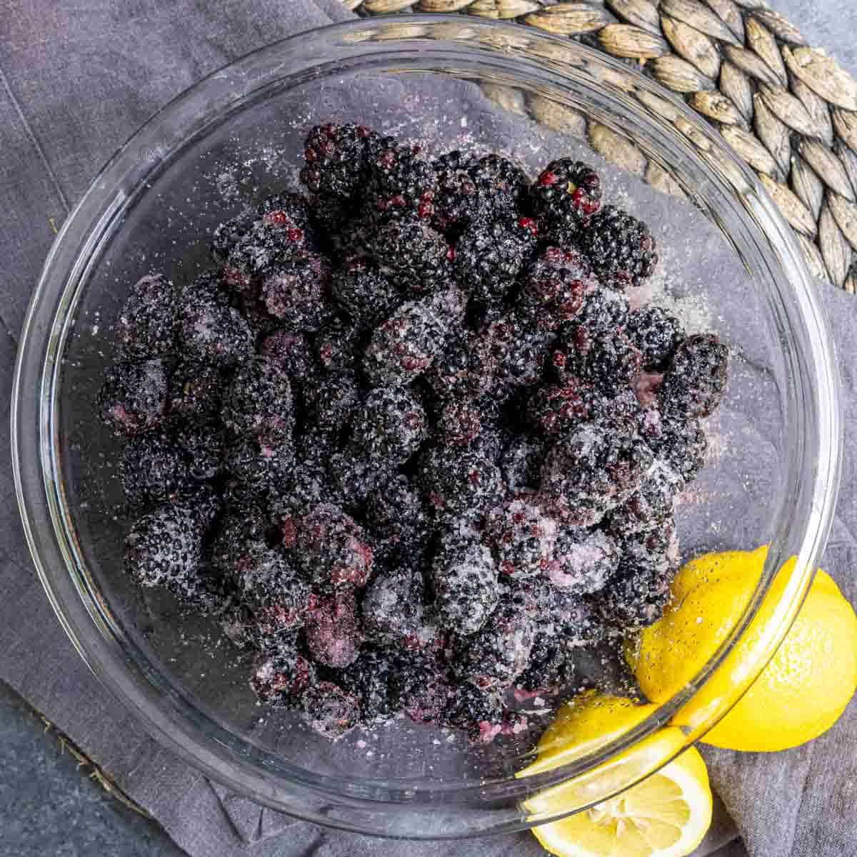 sugared blackberrys in glass bowl to make easy blackberry cobbler