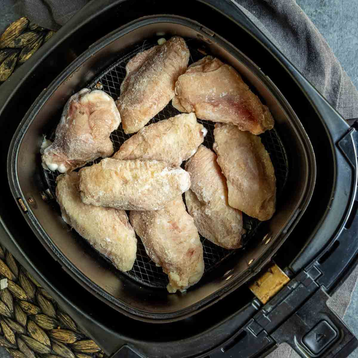 Frozen Chicken Wings in the Air Fryer in basket