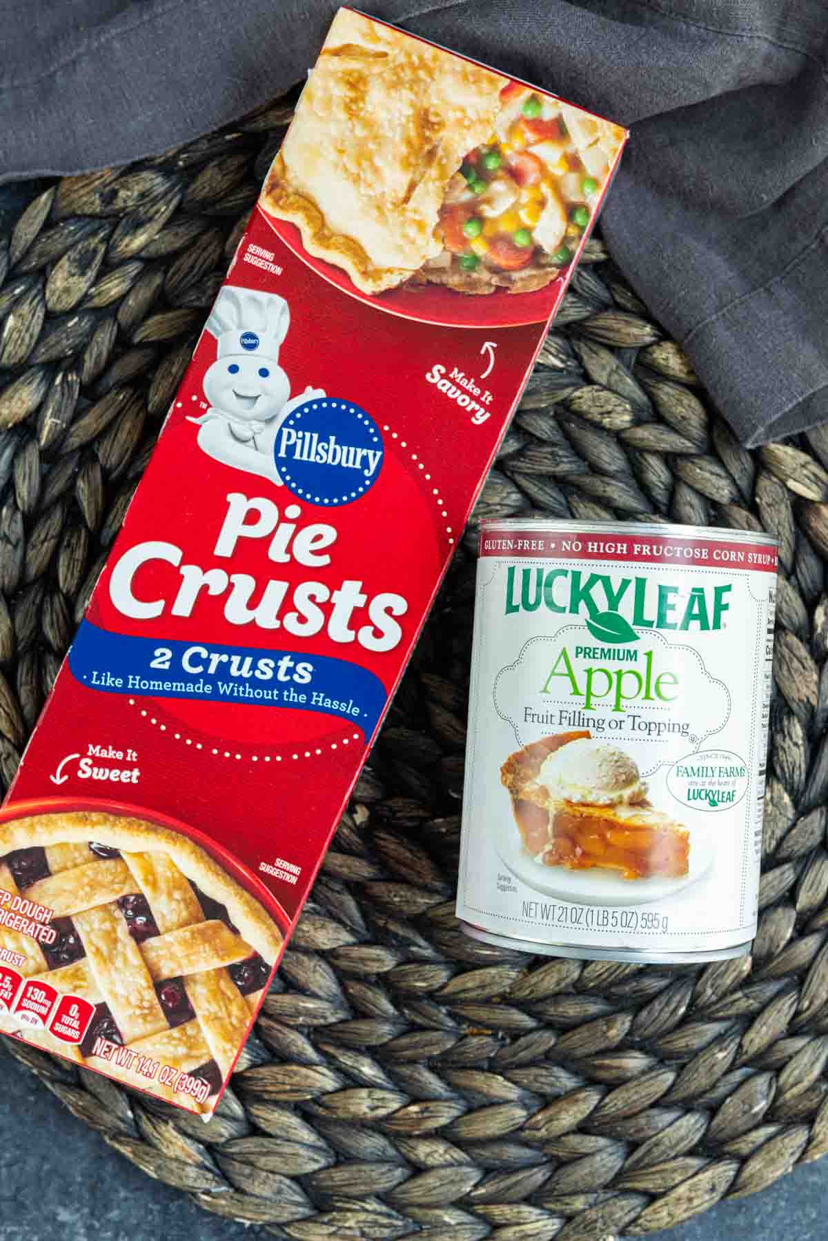 A box of pie crusts and a can of apple pie filling to make apple pie in a jar
