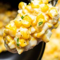 Corn on the cob in a black bowl.