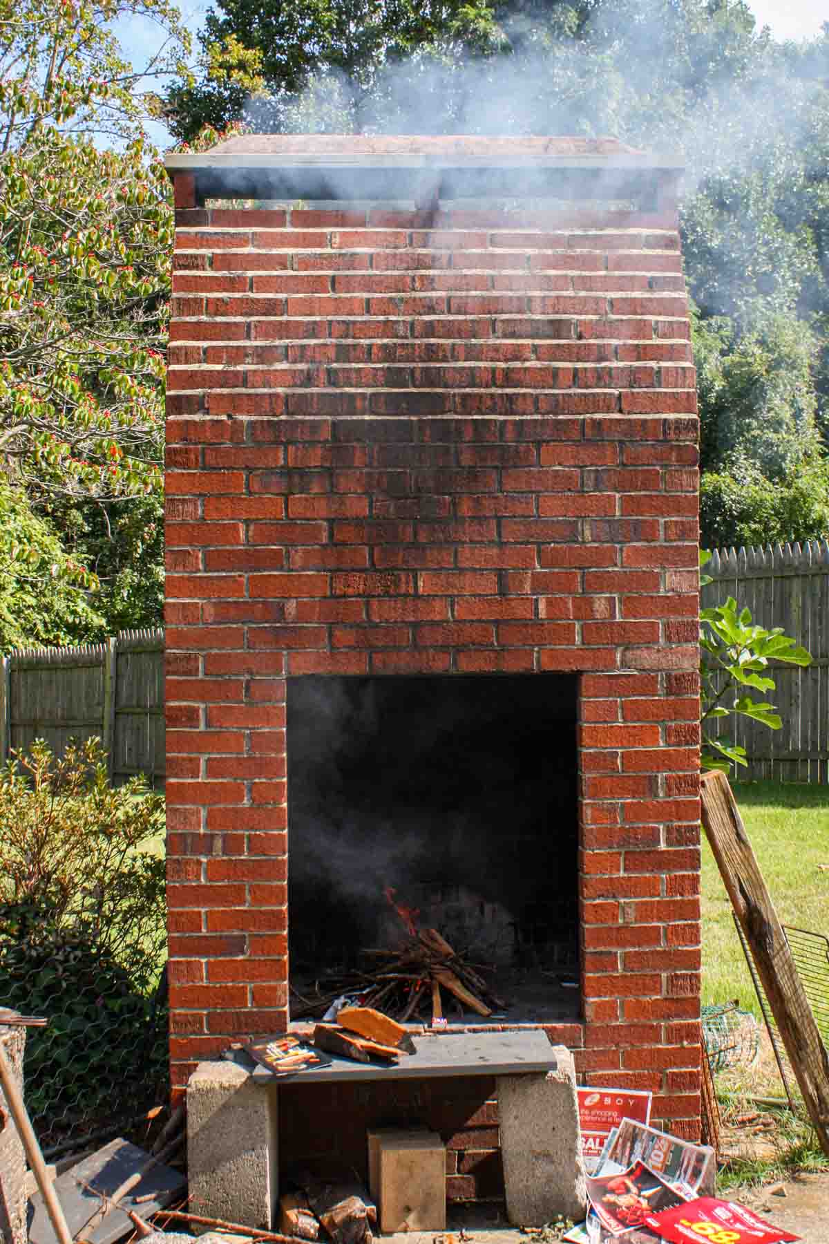A brick fireplace smoking Portuguese sausage