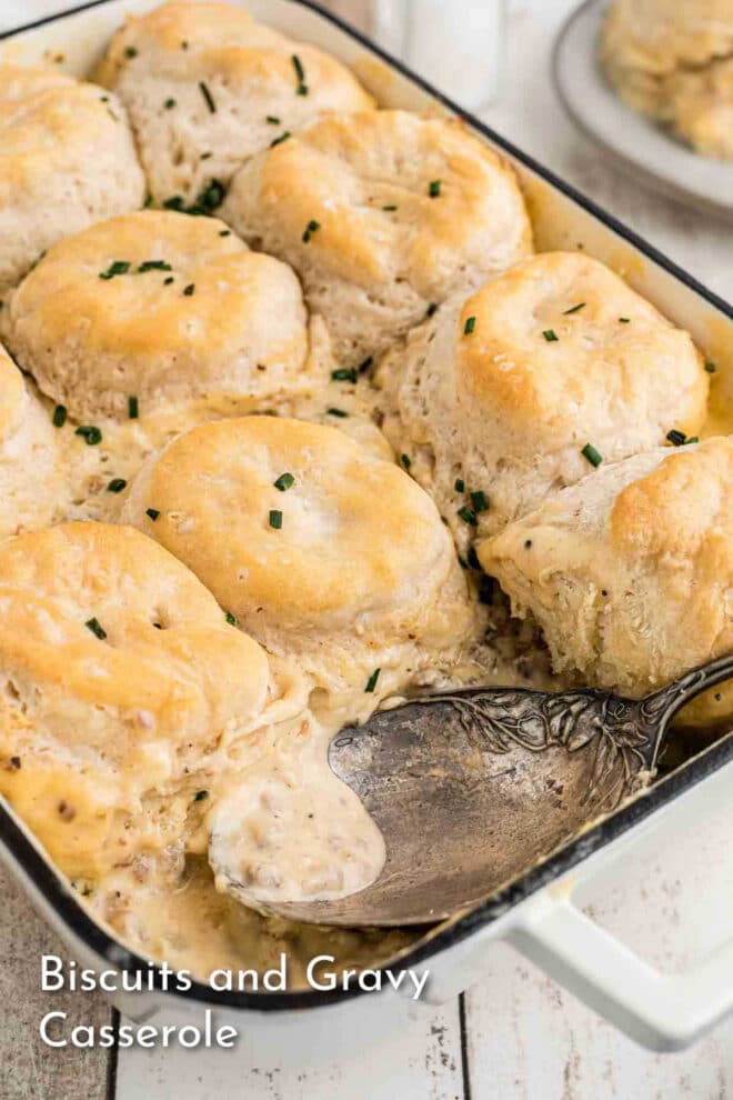 pinterest image of Biscuits and gravy casserole in a baking dish.