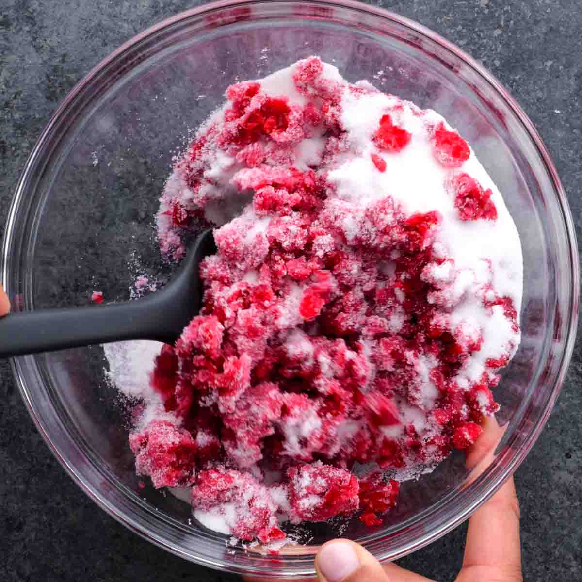 Cranberry Fluff in a bowl with whipped cream.