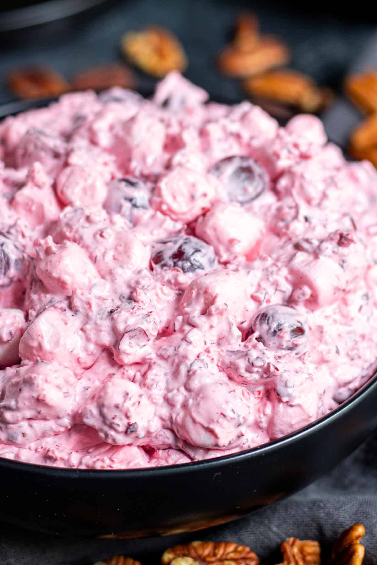 Cranberry Fluff in a bowl with pecans.