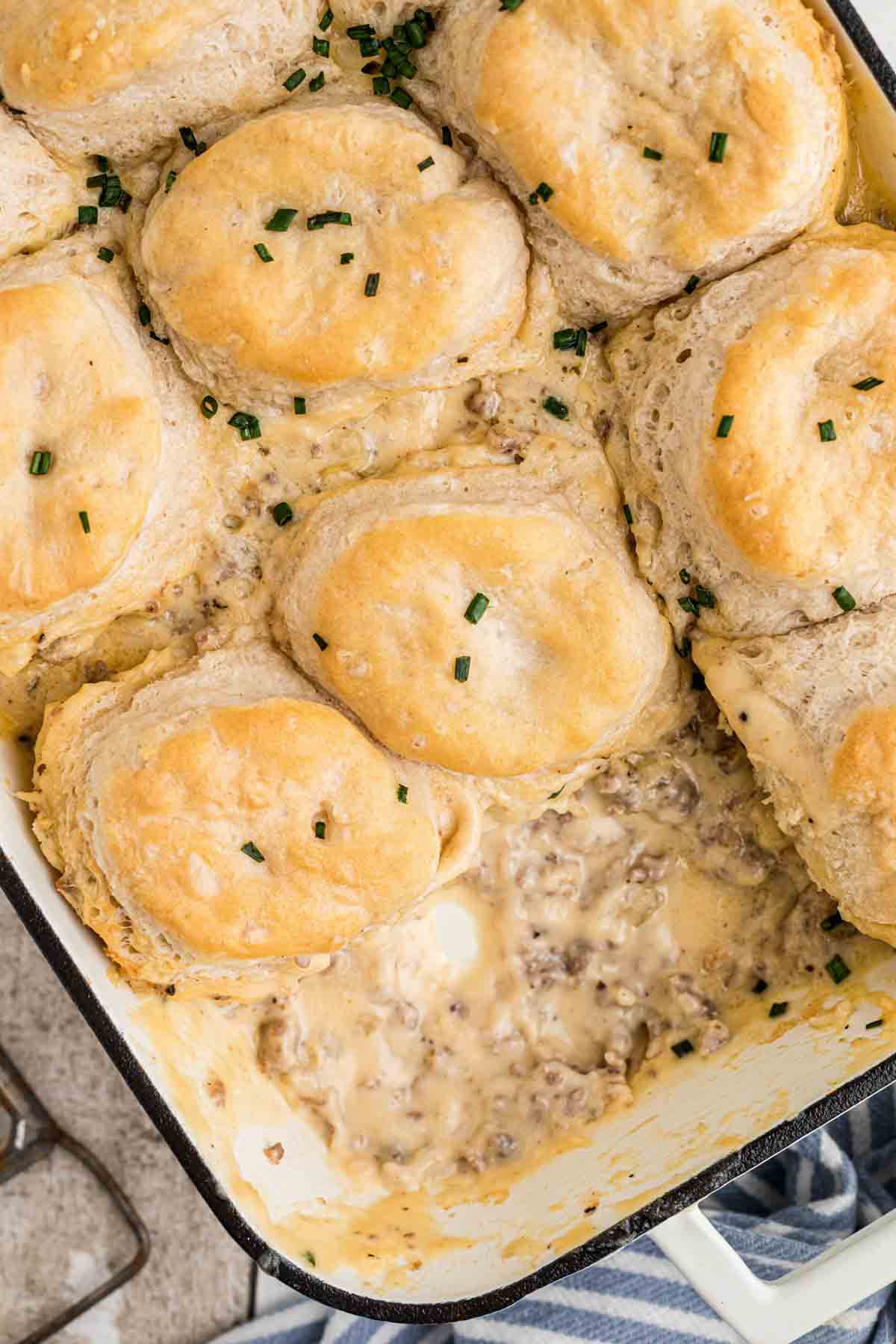 A casserole dish filled with Biscuits and Gravy Casserole