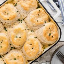 A casserole dish filled with biscuits and gravy casserole