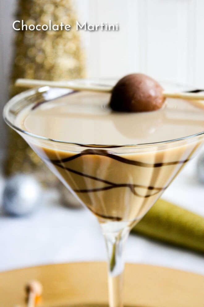 A chocolate martini with a chocolate garnish.