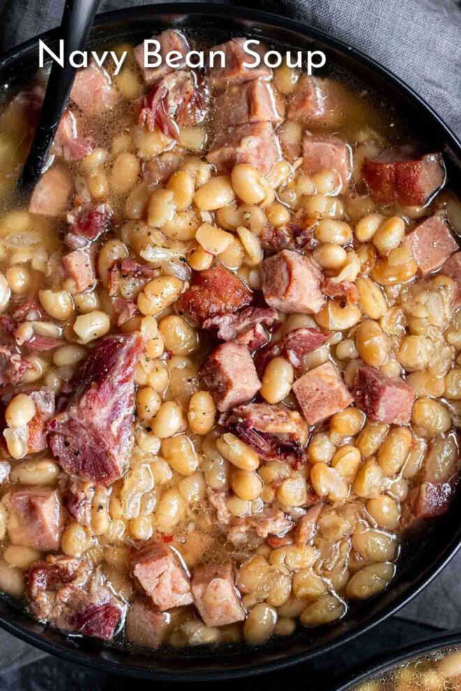 pinterest image Navy Bean Soup in a skillet with ham and beans.