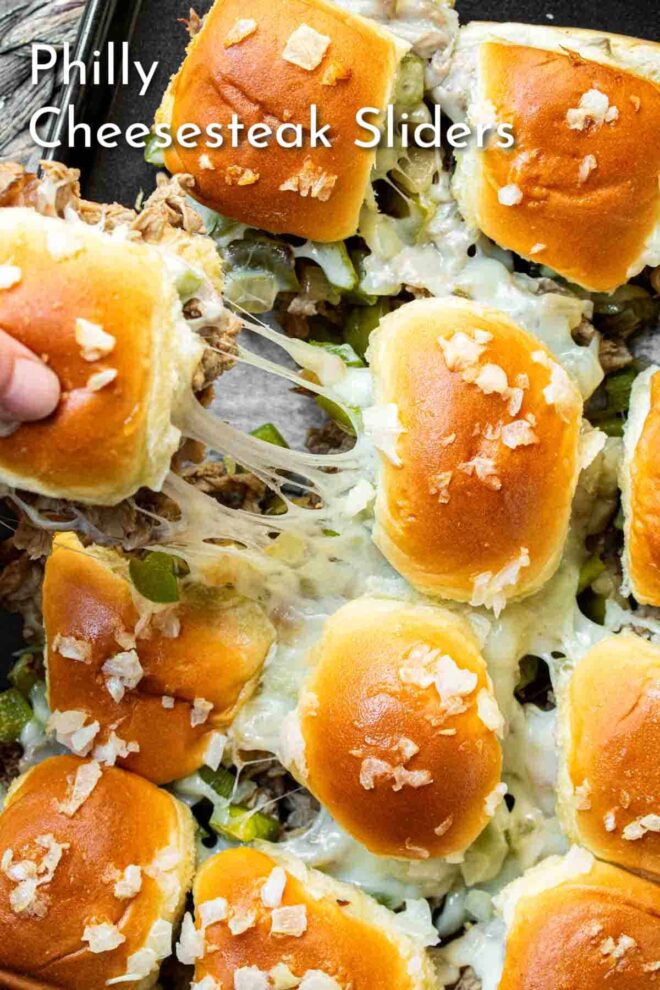 pinterest picture of Philly Cheesesteak Sliders in a pan.