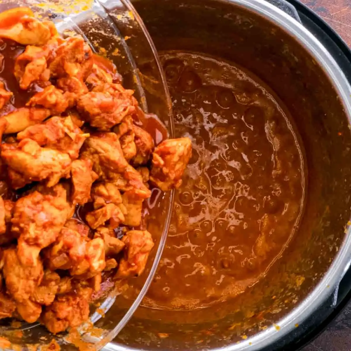 Instant Pot Butter Chicken in a bowl with sauce.