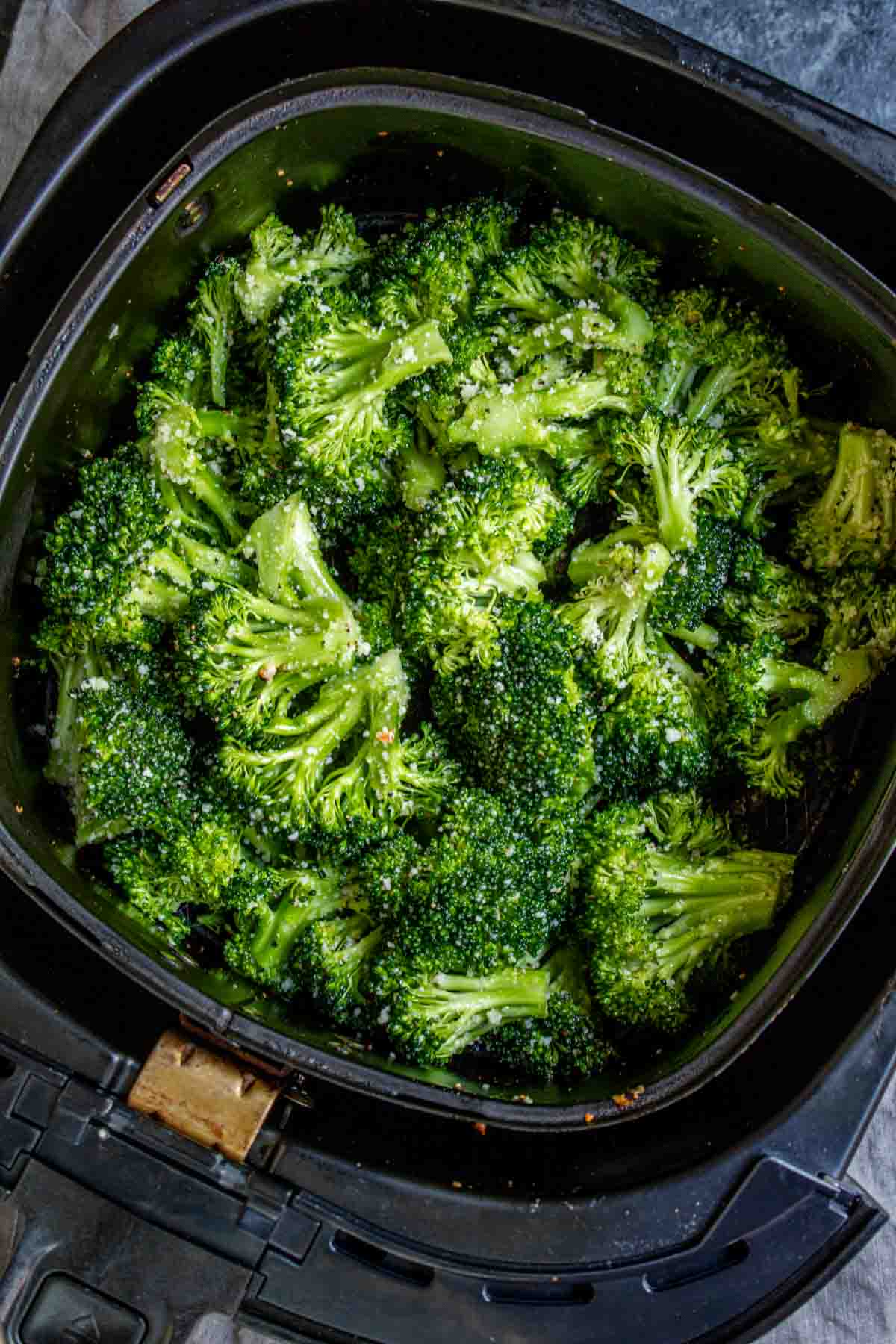 Air Fryer Broccoli in a black air fryer basket