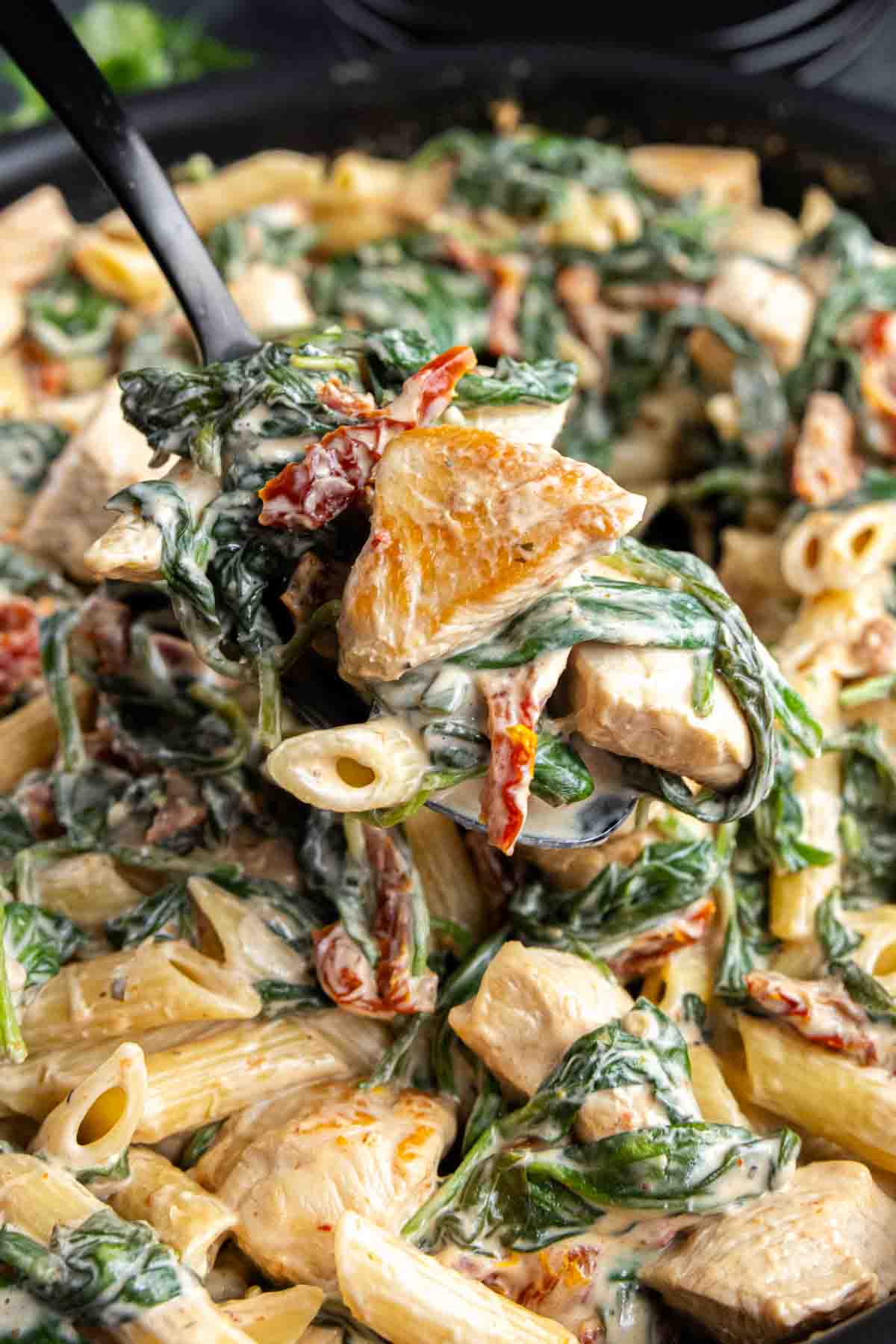 A creamy Chicken Florentine Casserole, spinach, and sun-dried tomatoes.