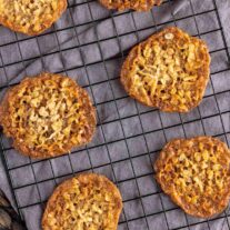 Crispy Coconut Cookies on a cooling rack.