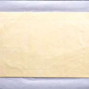Sheet of uncooked pastry dough on parchment paper for an Asparagus Goat Cheese Tart