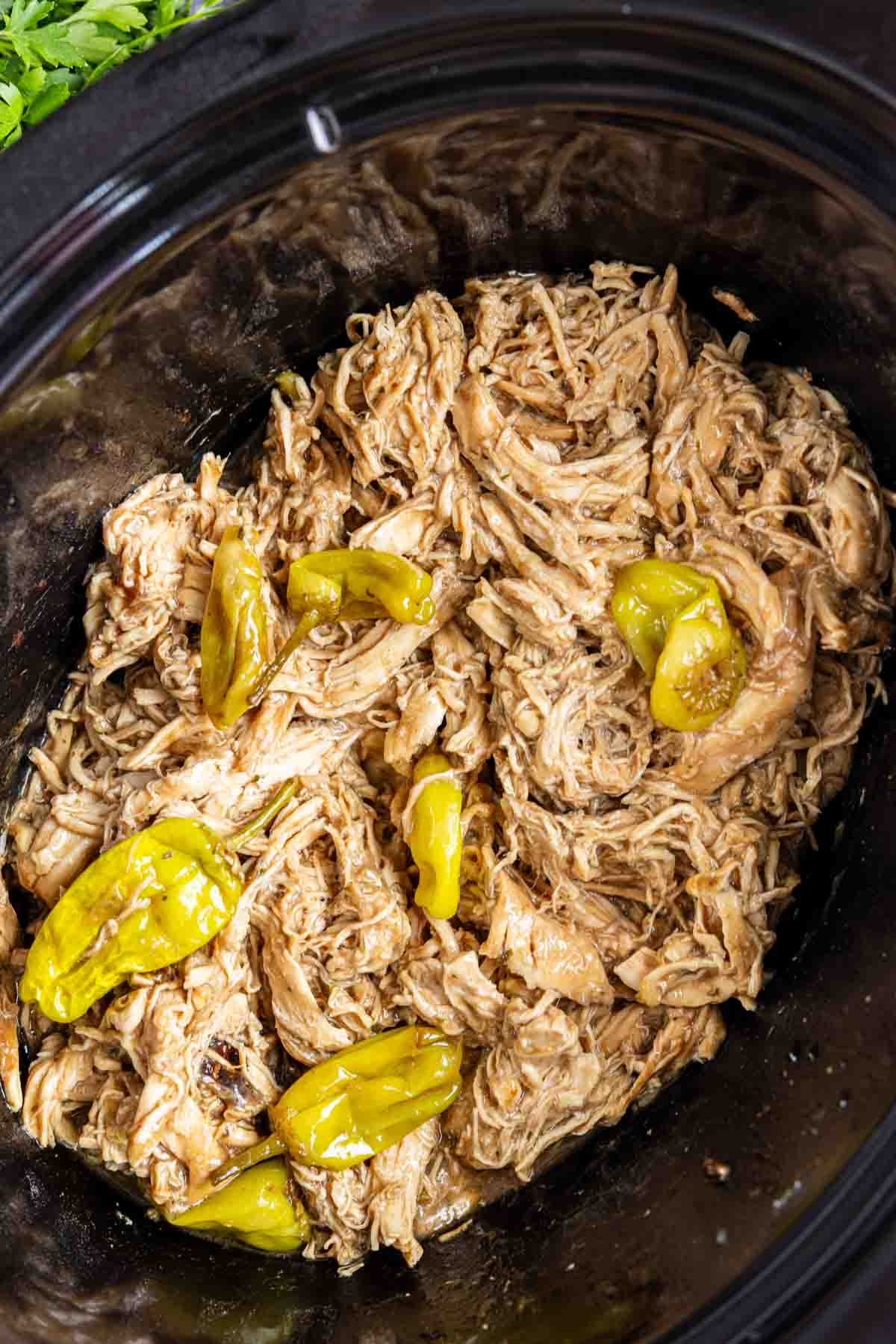 Shredded chicken with pepperoncini peppers, this Crockpot Mississippi Chicken is the ultimate dump and go crockpot meal.