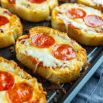 Slices of Texas Toast are topped with melted cheese and pepperoni, then baked to perfection on a sheet pan—making the ultimate mini pizza on Texas toast.