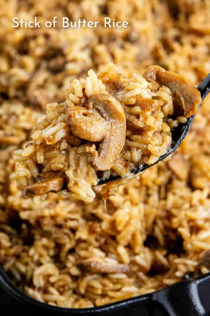 A spoonful of mushroom rice, with the text “Stick of Butter Rice” overlaid.